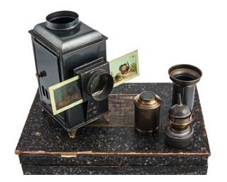 Boxed magic lantern, accessories and slides. Image © The Bill Douglas Cinema Museum