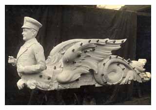 Piece of a fairground ride, a conductor and angel wings, from the Orton and Spooner collection. Image © The National Fairground Archive, University of Sheffield